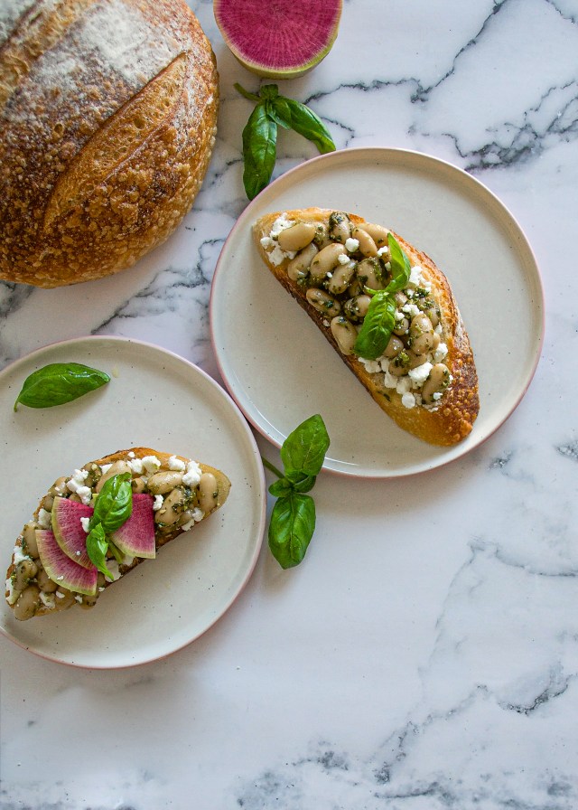 pesto beans on toast on marble b:g